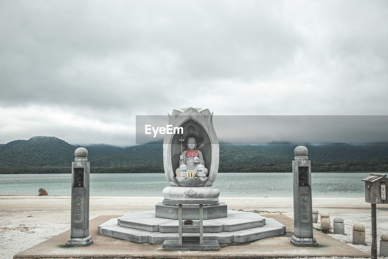 low angle view of statue against sky