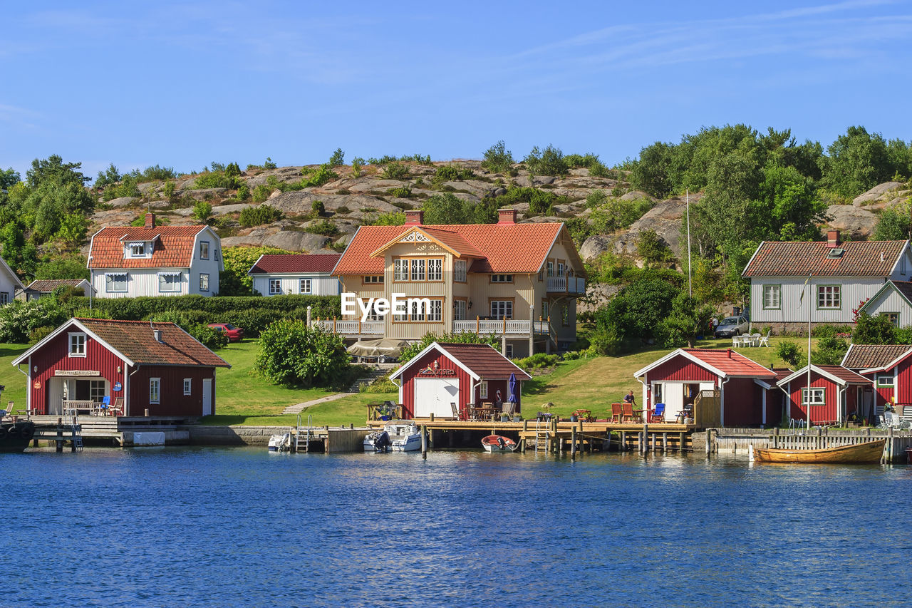 Summer houses with boats and jetties on the swedish west coast