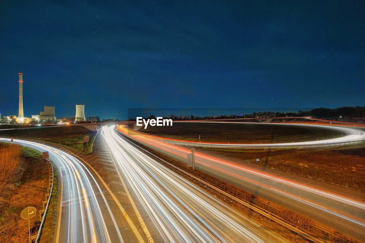 High angle view of light trails on road at night