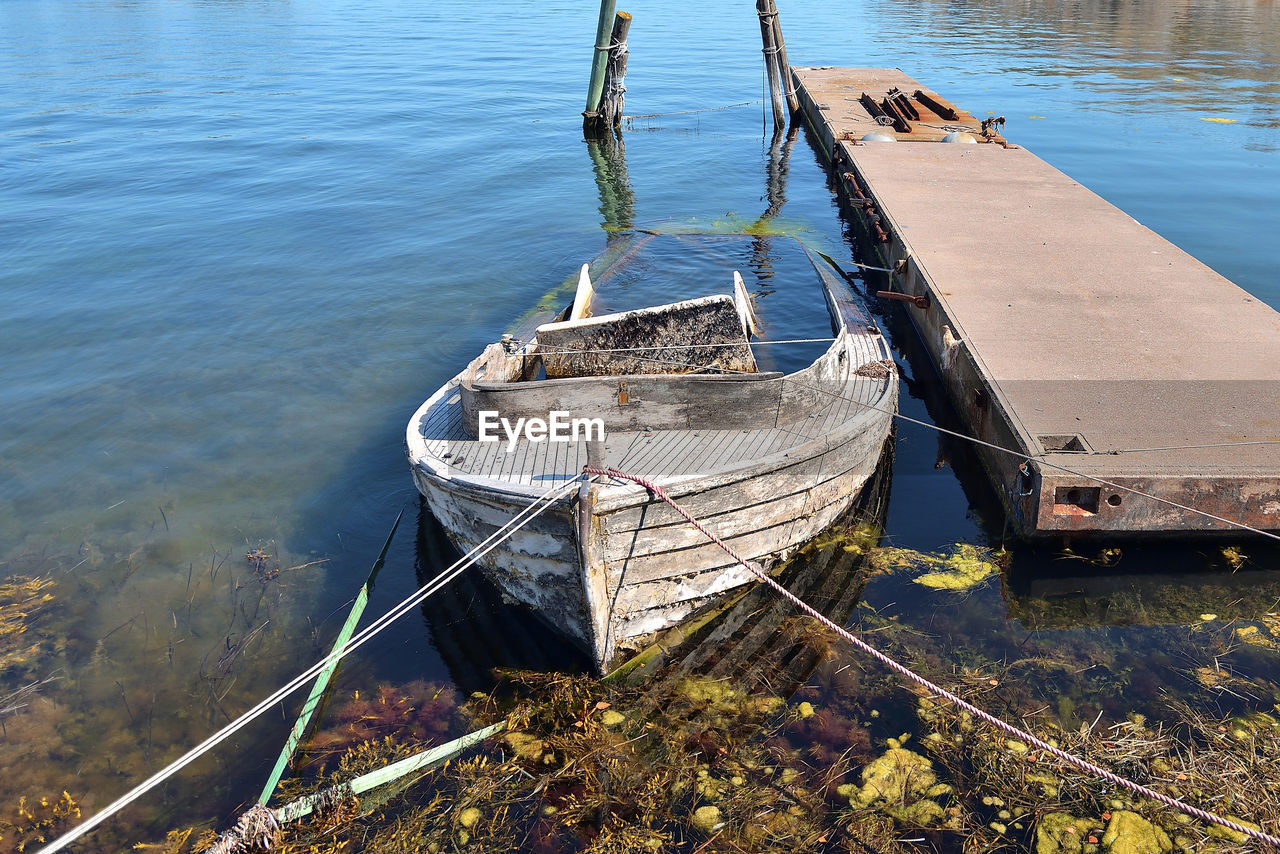 High angle view of old boat moored at pier