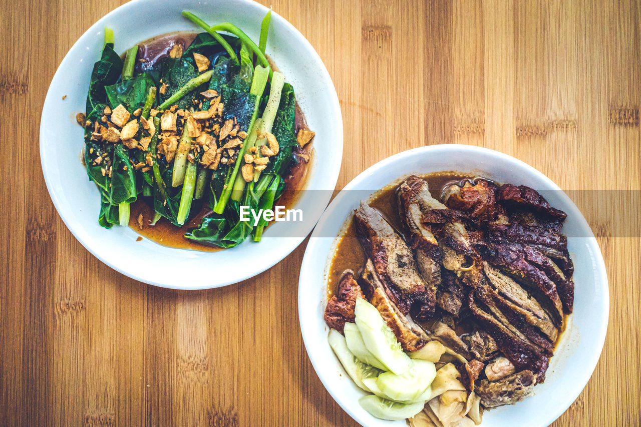 HIGH ANGLE VIEW OF MEAL SERVED IN BOWL ON TABLE