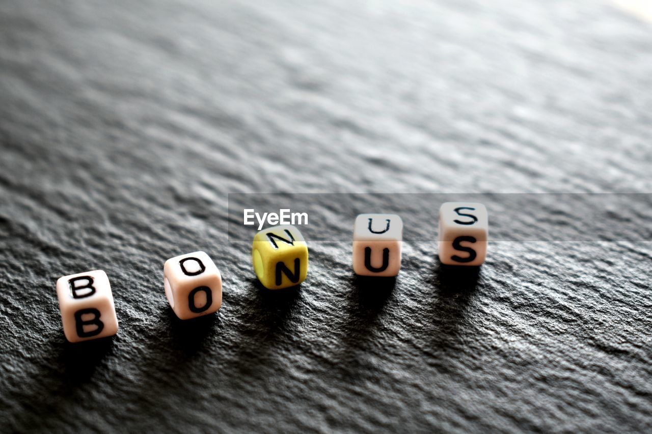 High angle view of text dices on table