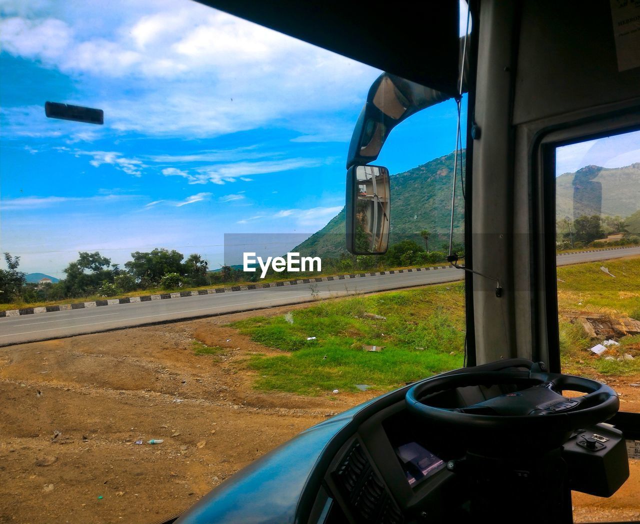 HIGH ANGLE VIEW OF ROAD AGAINST SKY