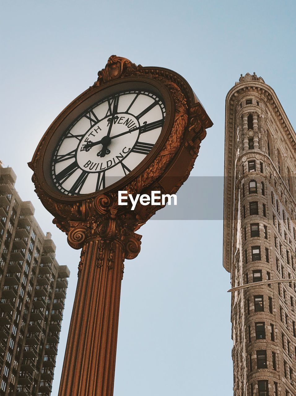 Low angle view of clock tower against sky