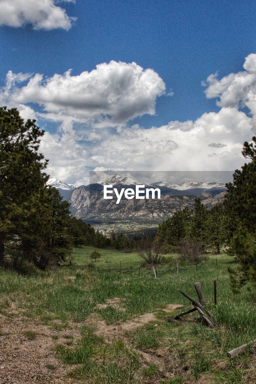 SCENIC VIEW OF LAND AND MOUNTAINS AGAINST SKY