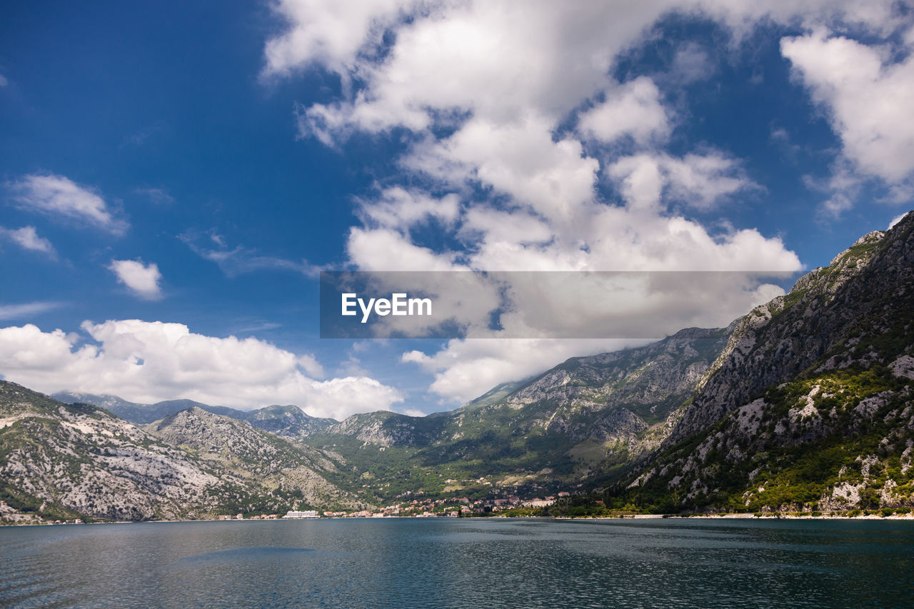 Scenic view of lake against cloudy sky