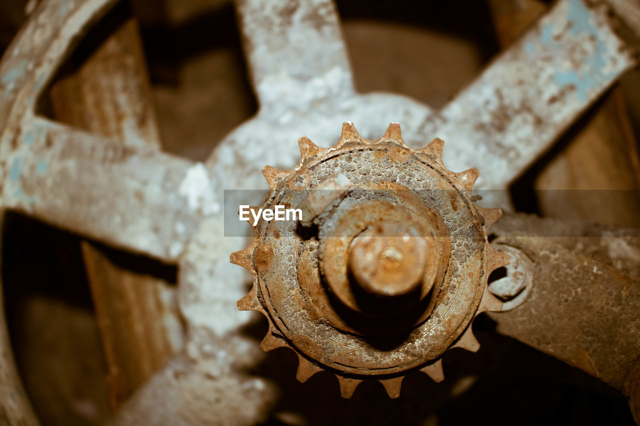 HIGH ANGLE VIEW OF RUSTY MACHINE PART