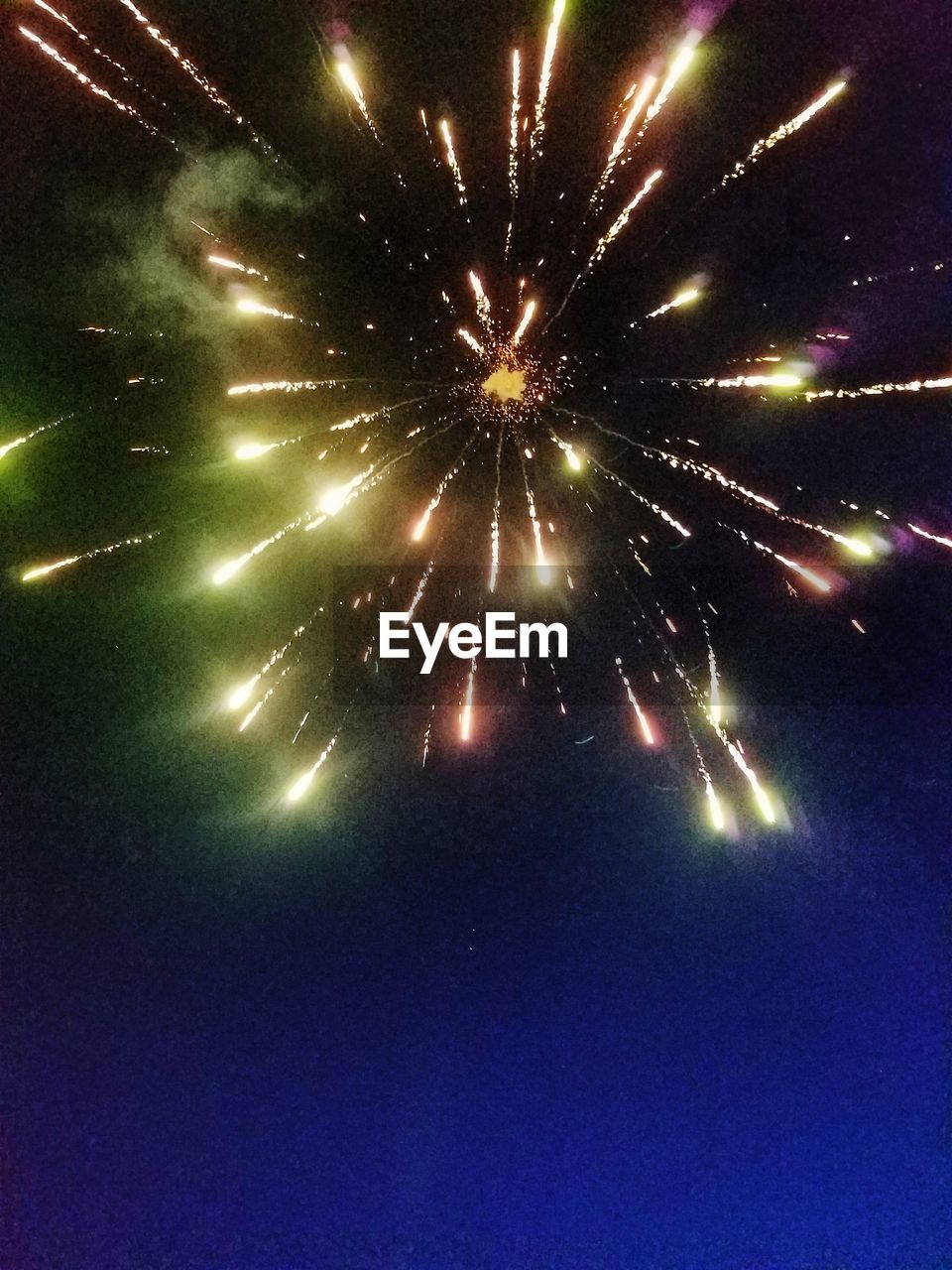 LOW ANGLE VIEW OF FIREWORK DISPLAY AGAINST SKY AT NIGHT