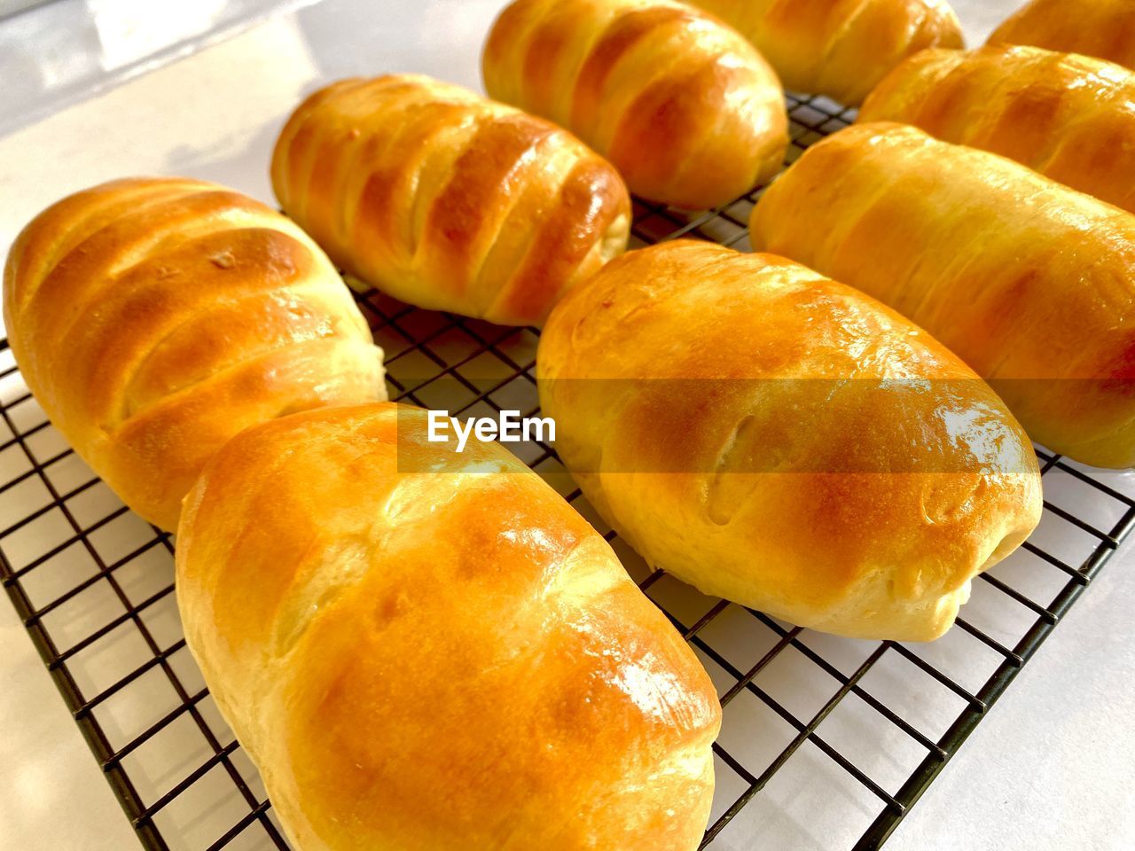 food, food and drink, freshness, fast food, baked, cuisine, no people, dessert, still life, indoors, close-up, dish, bread, high angle view, sweet food, bread roll, healthy eating, cooling rack, french food, group of objects, wellbeing, snack, in a row