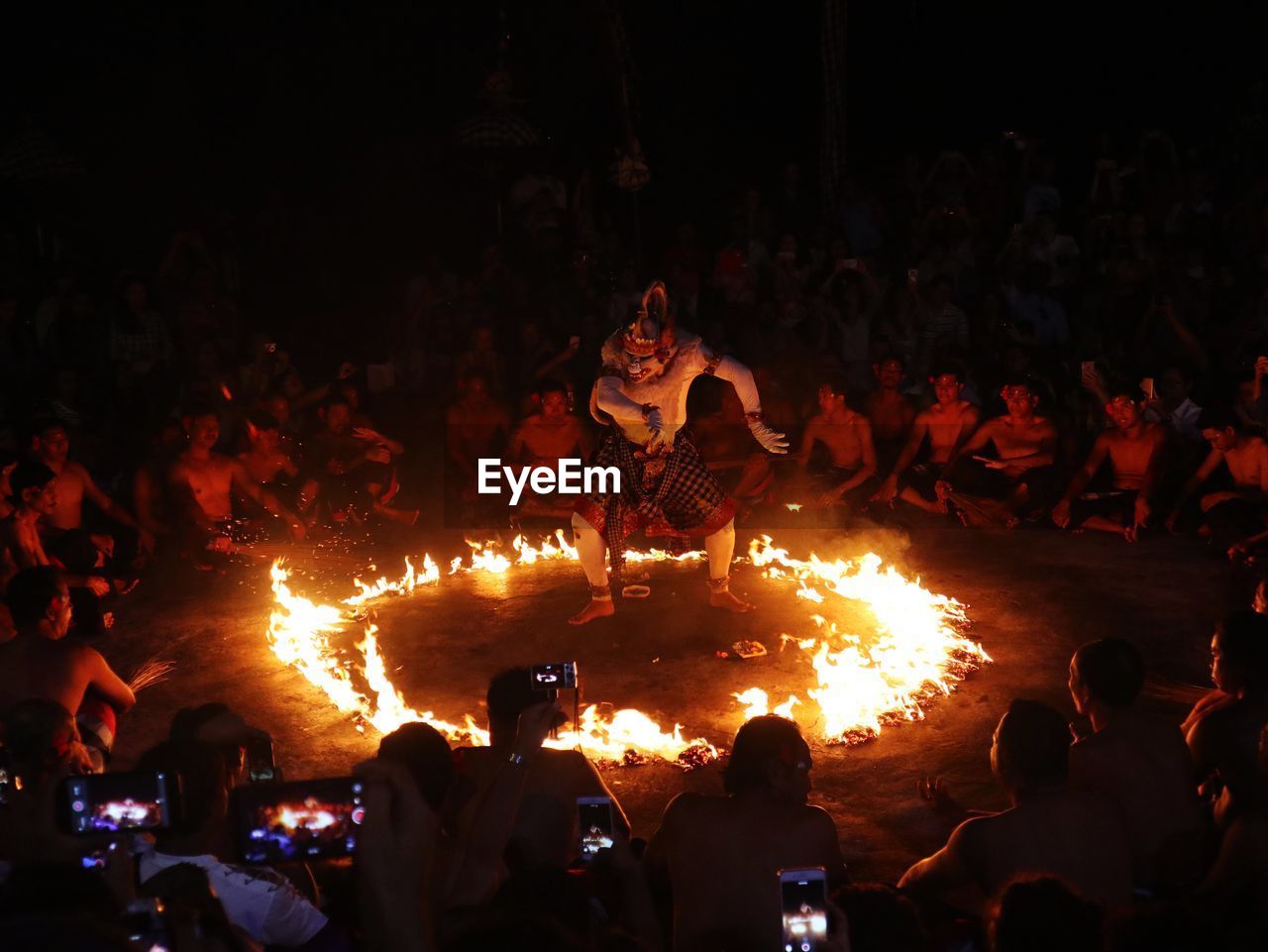 crowd, group of people, large group of people, night, campfire, heat, burning, bonfire, fire, flame, men, performance, nature, arts culture and entertainment, event, adult, performance art, lifestyles, enjoyment, women, outdoors