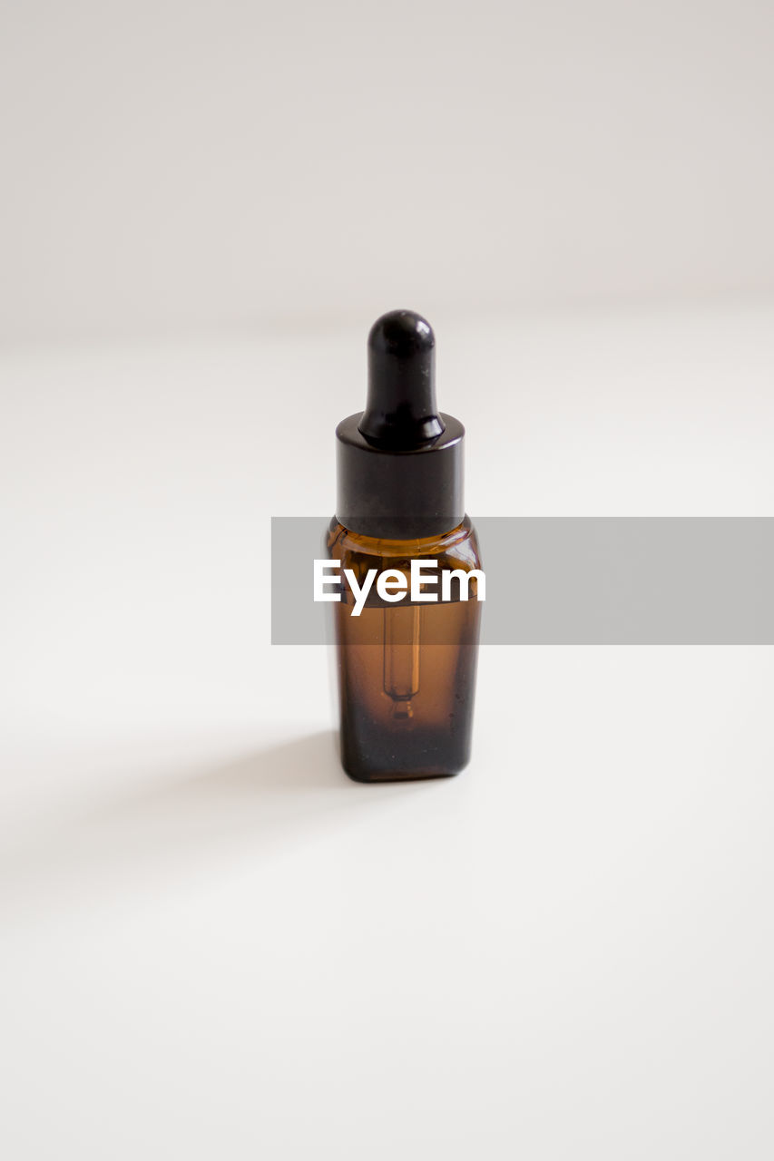 Essential oil bottle on table