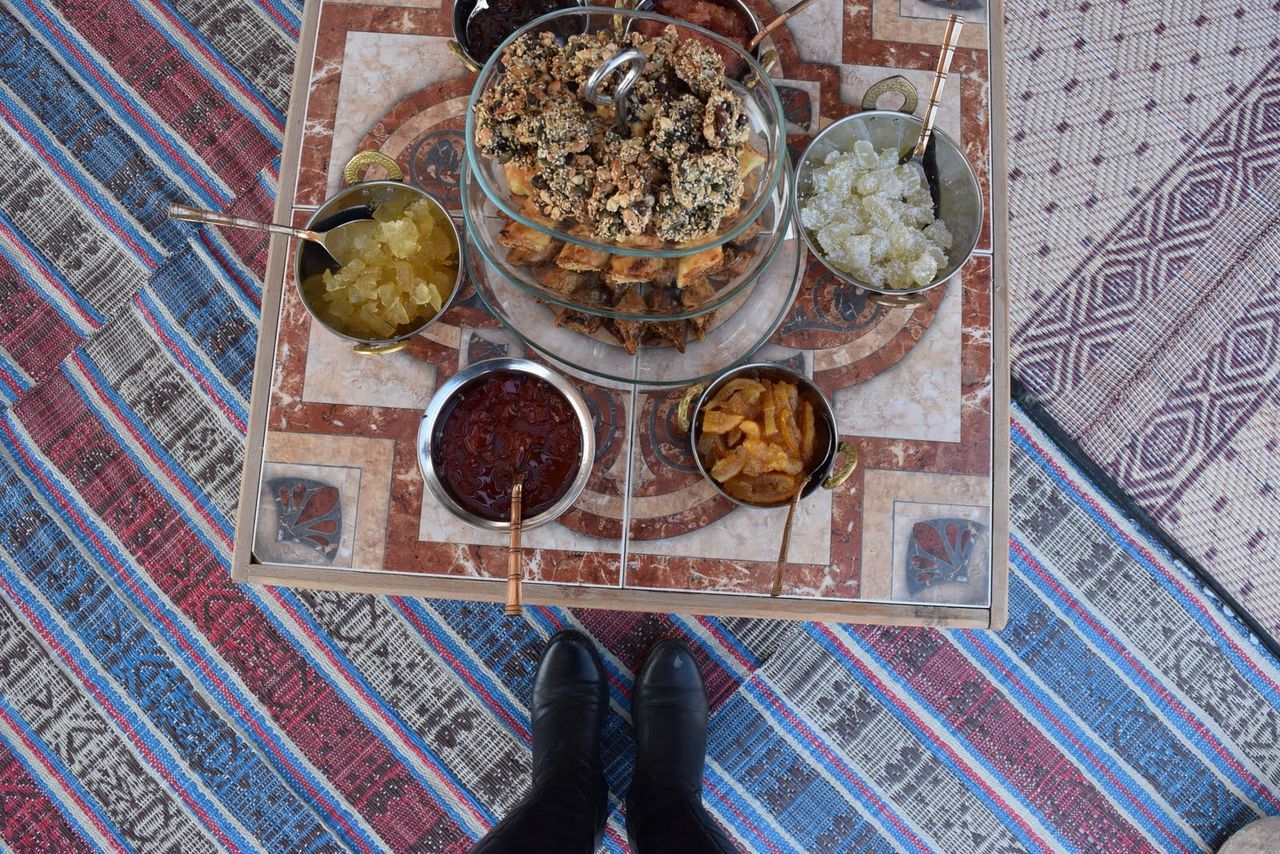 HIGH ANGLE VIEW OF MAN IN PLATE ON METAL