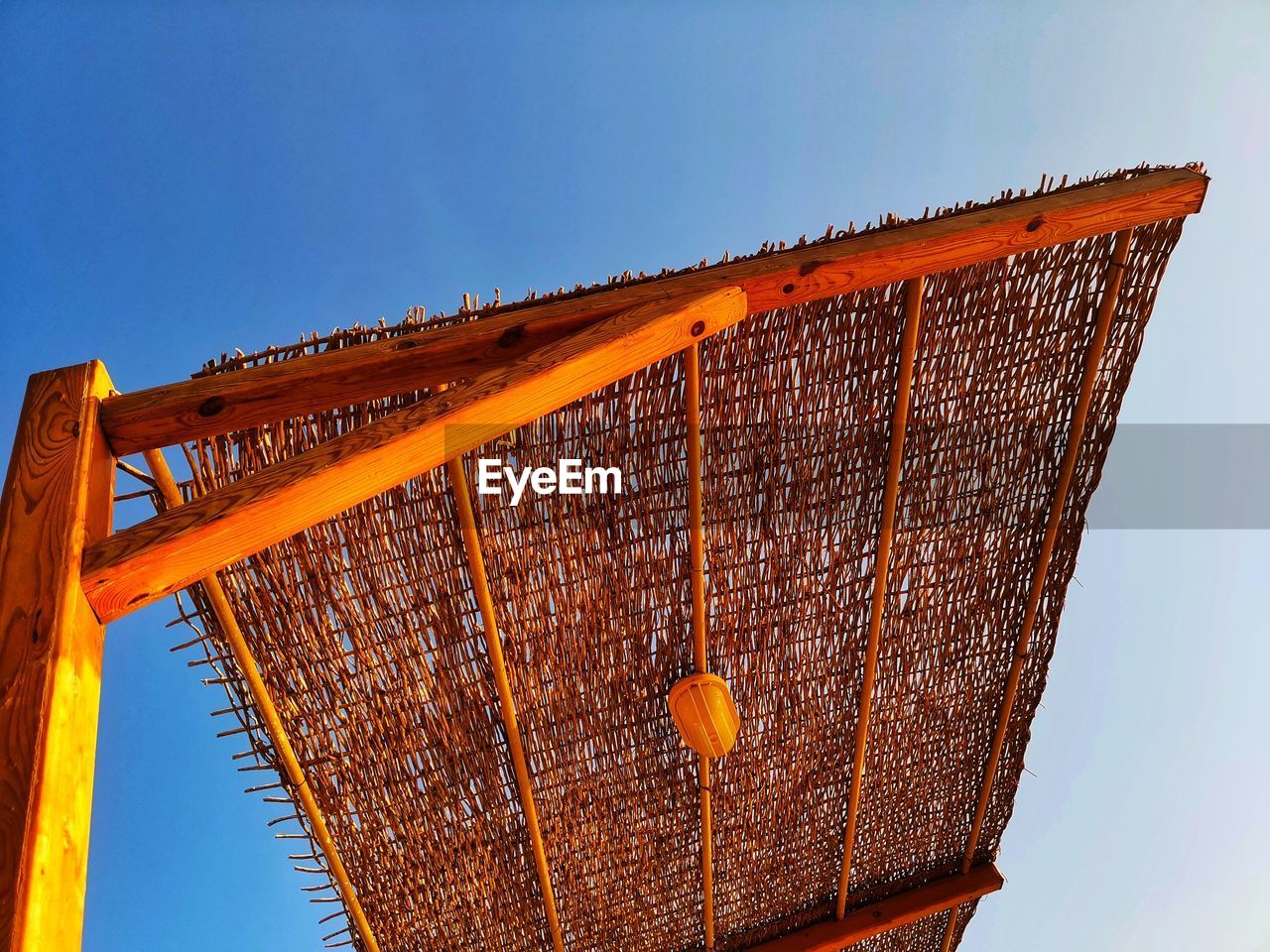 LOW ANGLE VIEW OF METALLIC STRUCTURE AGAINST CLEAR SKY