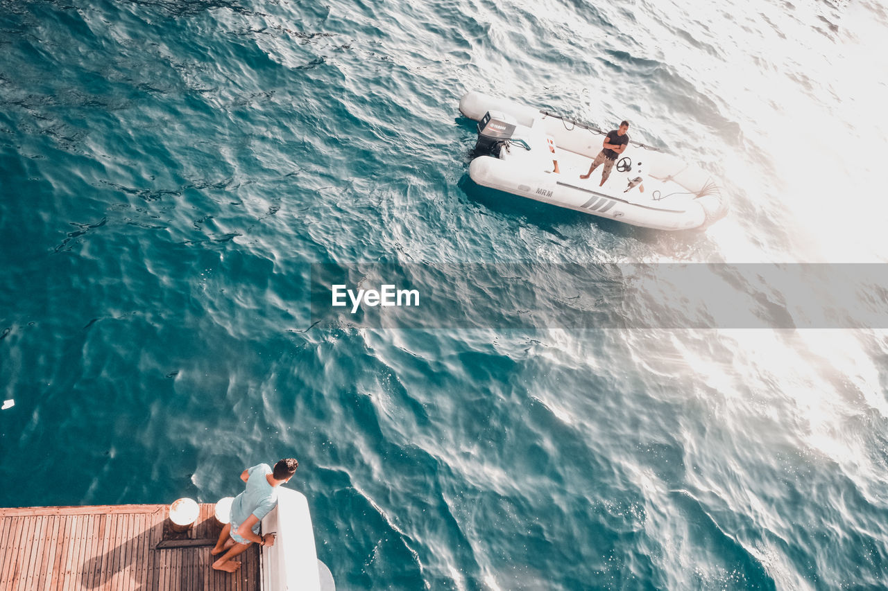 PEOPLE ENJOYING AT SEA