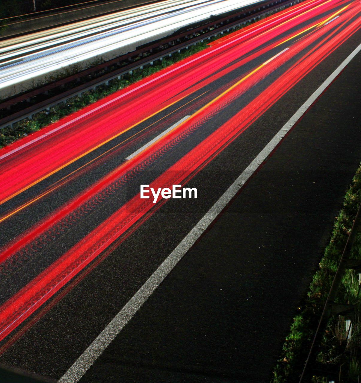 High angle view of light trails on road at night