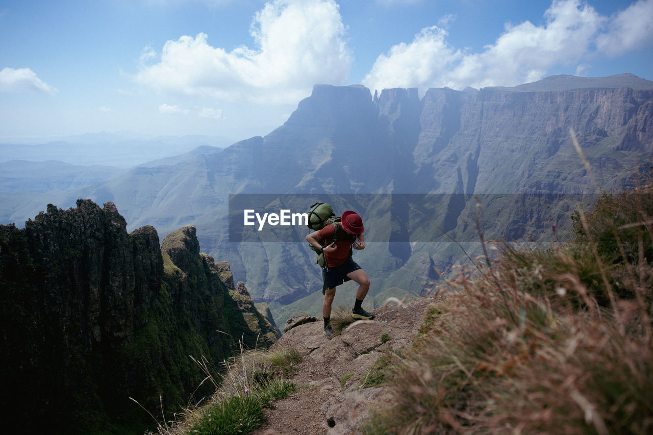 Rear view of man walking on mountain