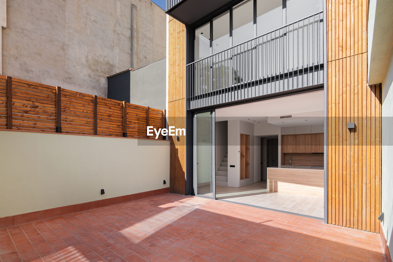 Sunny view of the patio of refurbished apartment in contemporary building in barcelona, spain