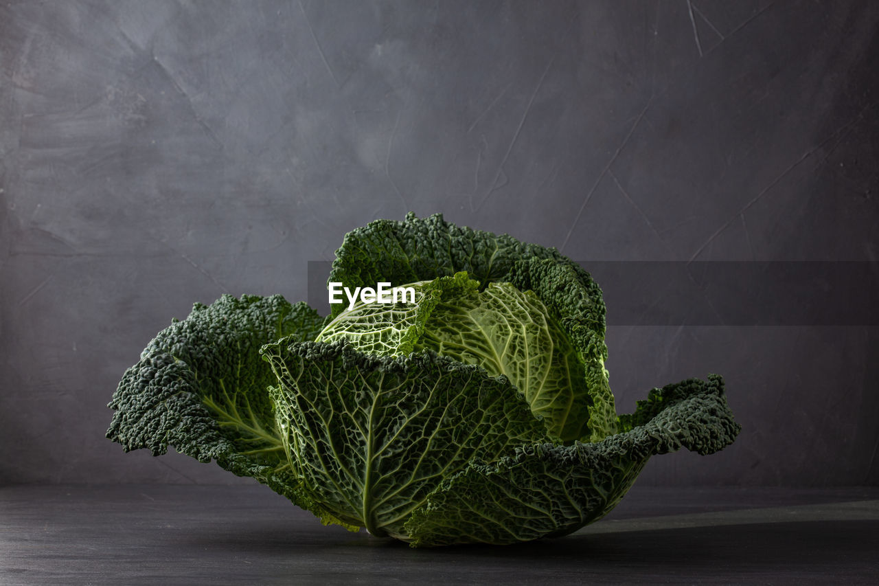 Close-up of green cabbage on table