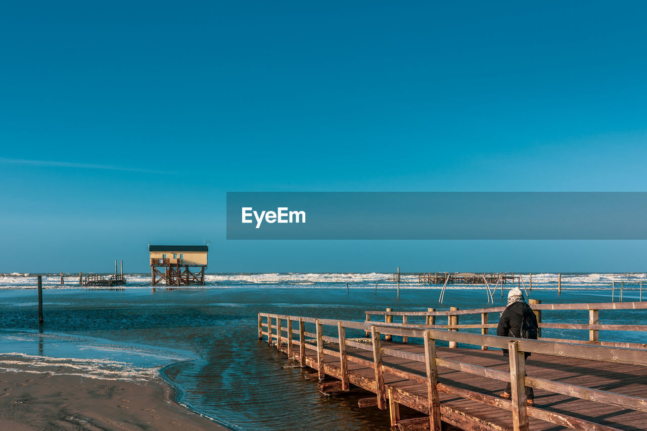 Pile dwelling on the beach of sankt peter-ording in germany.