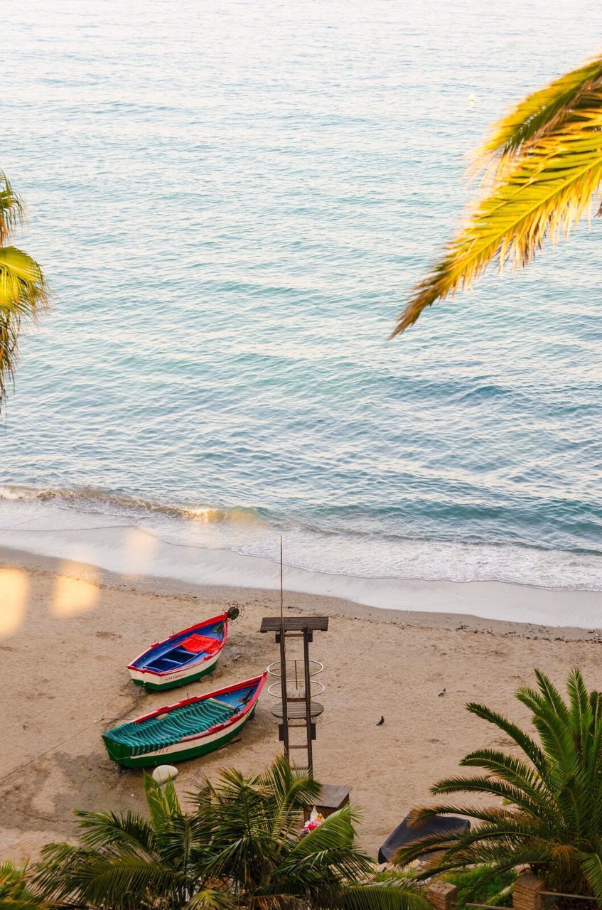 High angle view of boats moored at beach