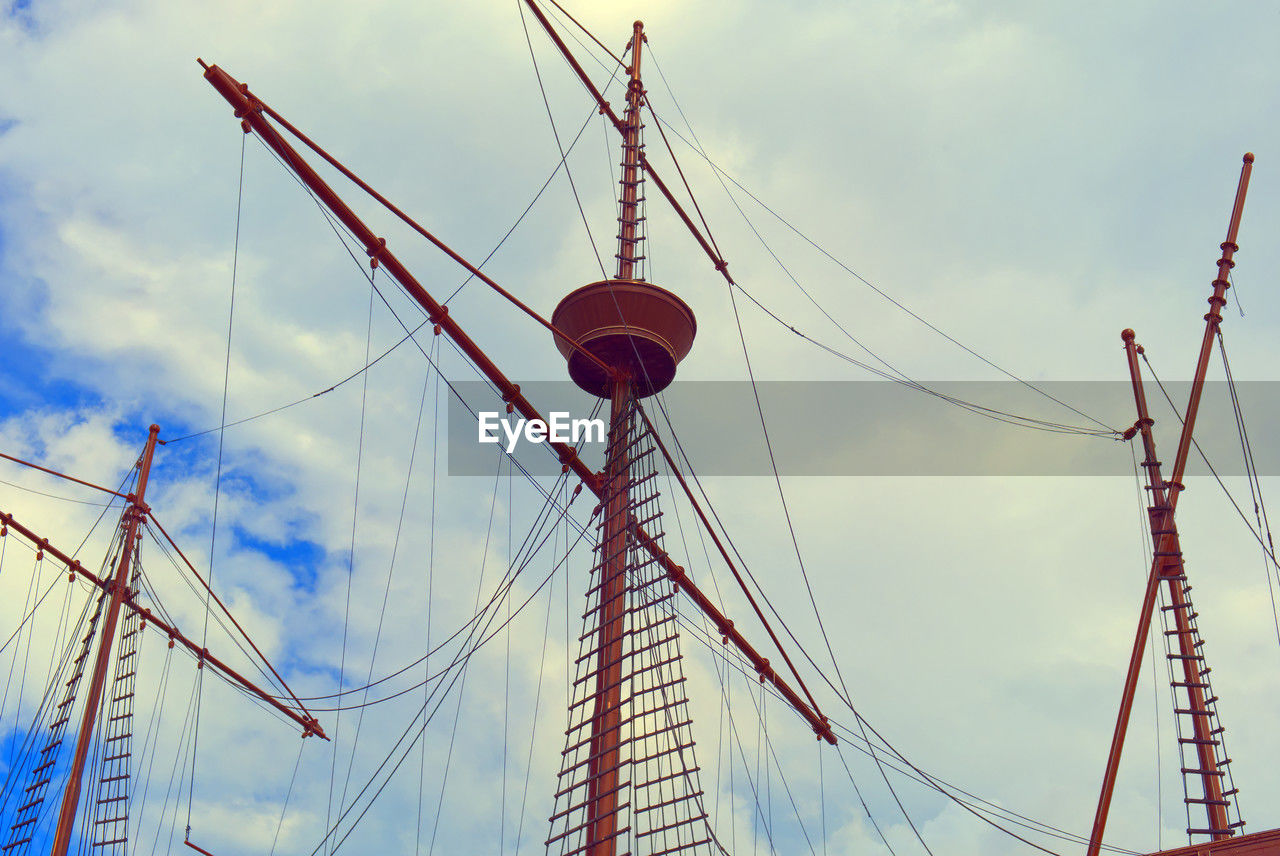 sky, cloud, nature, transportation, architecture, mast, low angle view, vehicle, no people, sailboat, electricity, nautical vessel, rope, outdoors, mode of transportation, day, overhead power line, tower, red, pole, built structure, ship, amusement park, water, amusement park ride, travel destinations, travel