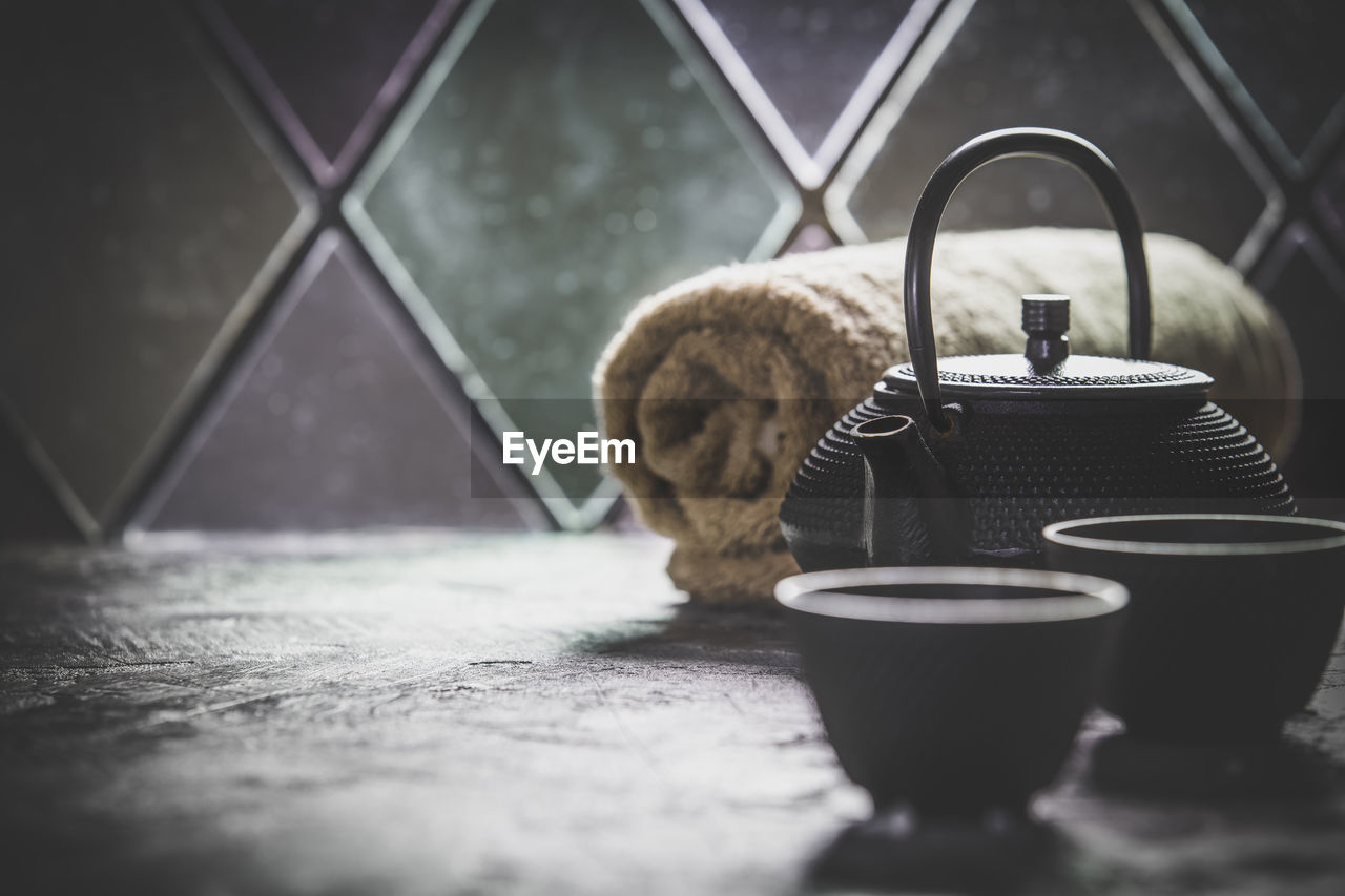 Close-up of tea pot on table