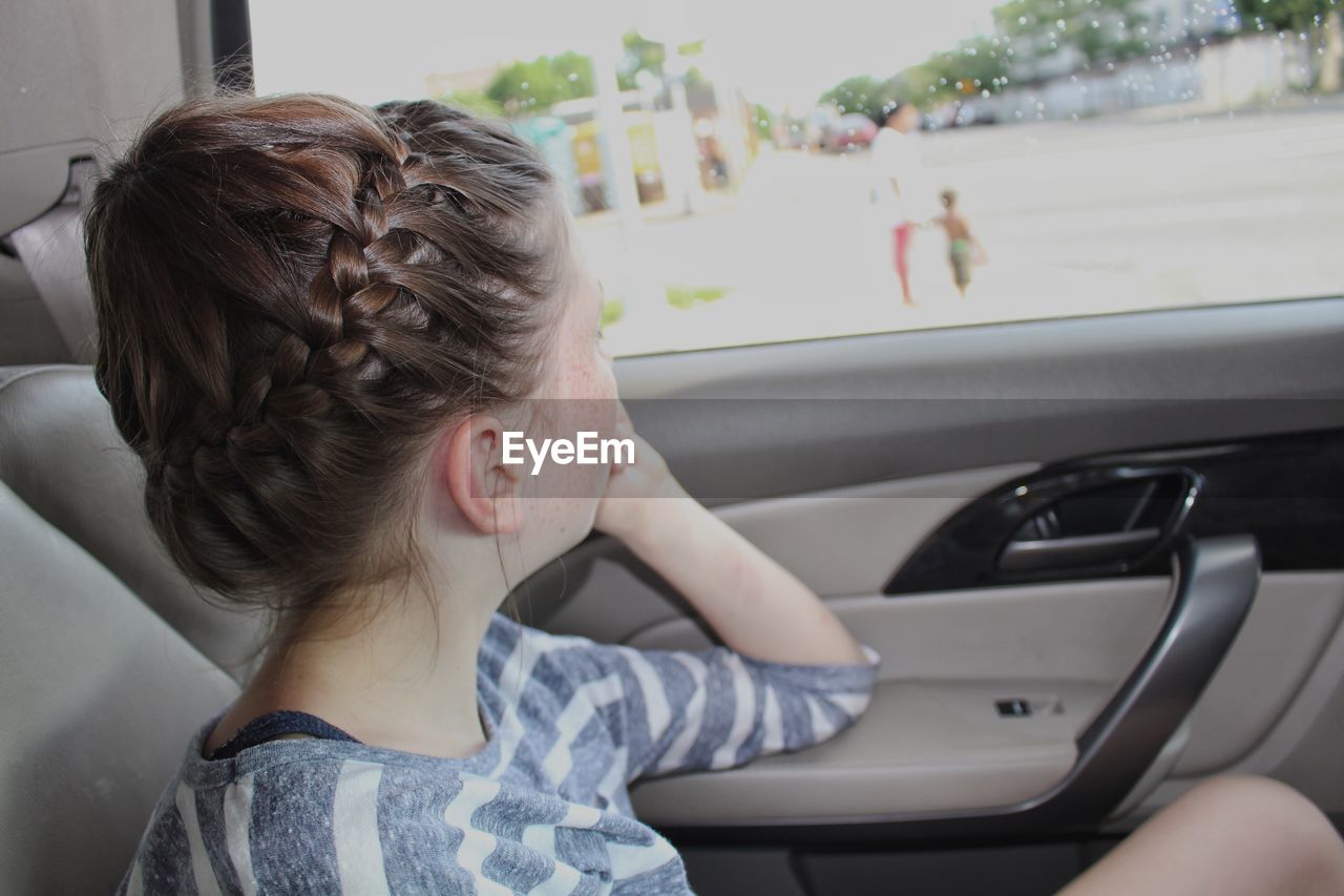 WOMEN SITTING IN CAR