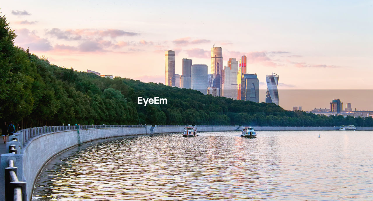 SCENIC VIEW OF RIVER AGAINST SKY AT SUNSET