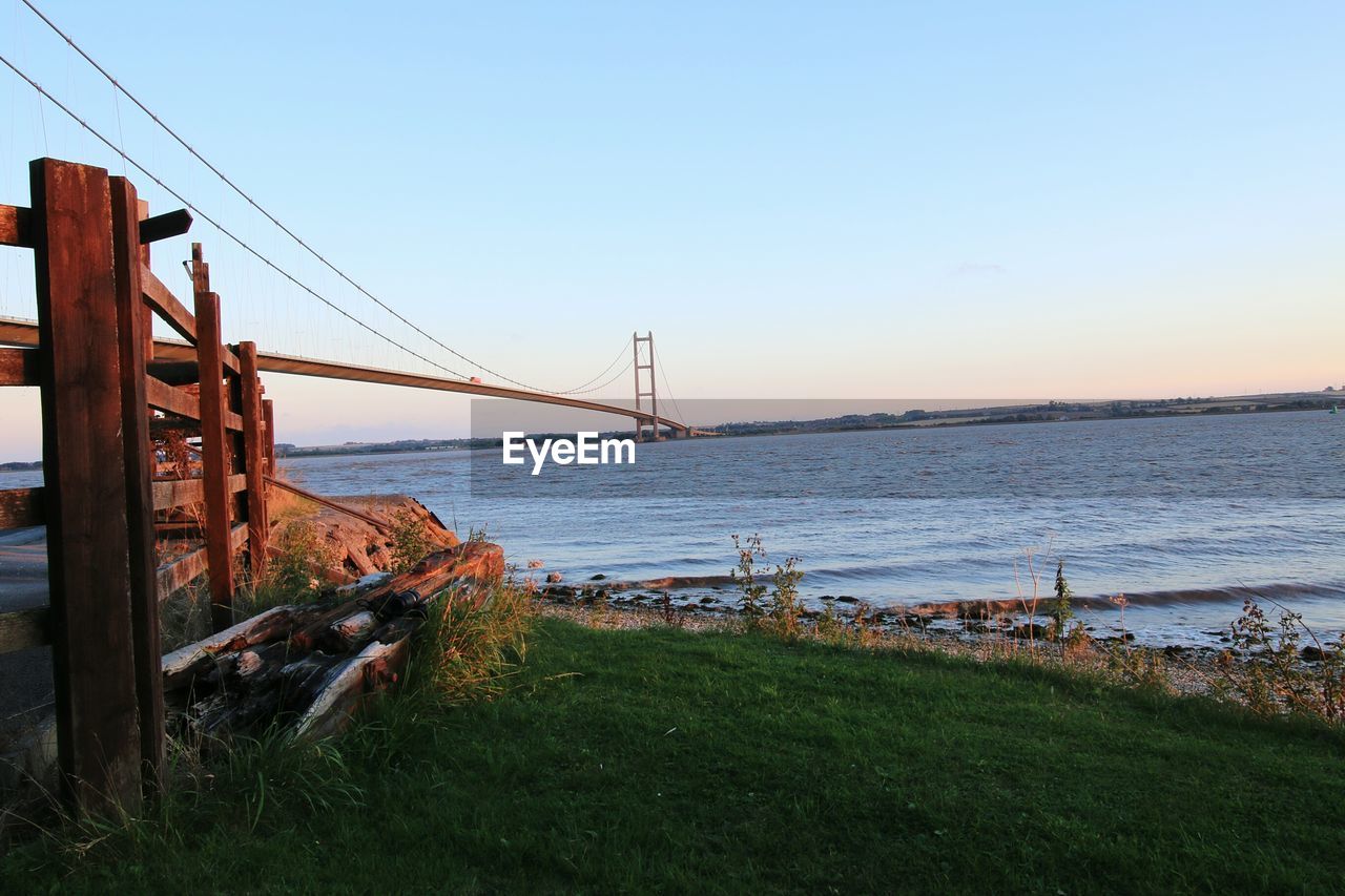 Bridge over river against clear sky