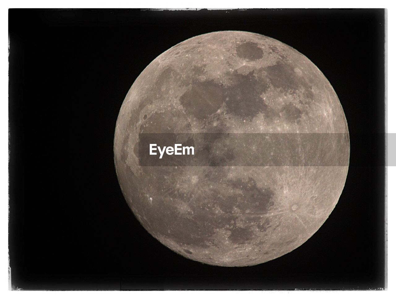 LOW ANGLE VIEW OF MOON AGAINST CLEAR SKY