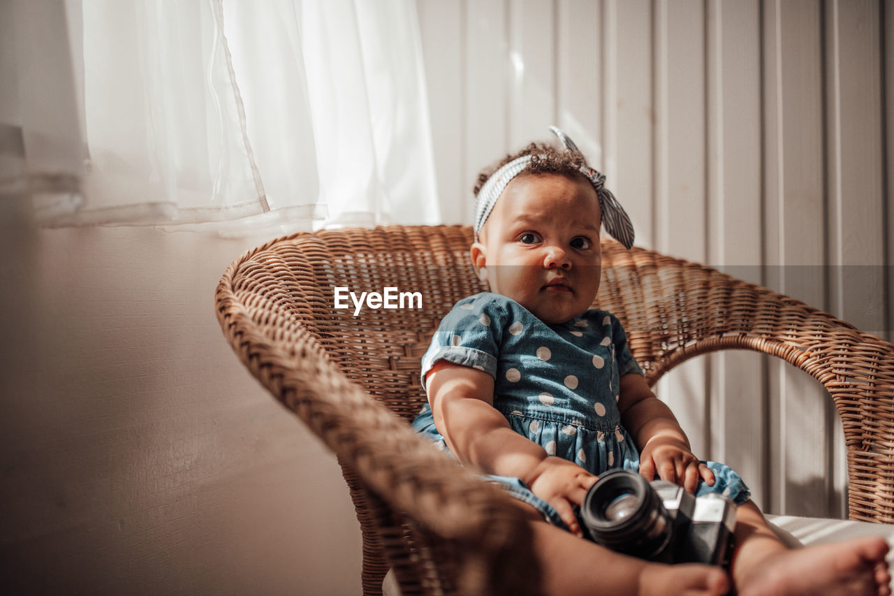 Portrait of cute baby girl at home