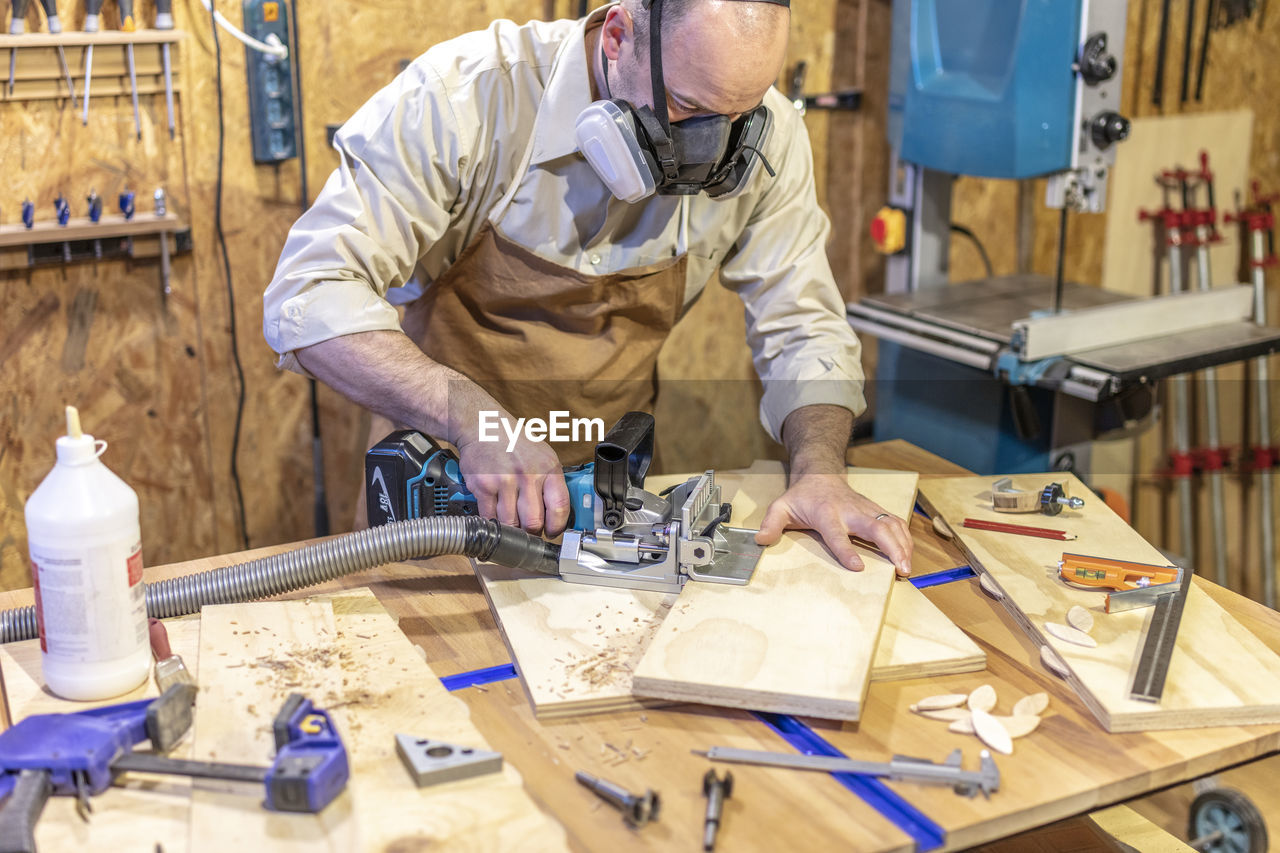 portrait of manual worker working at workshop