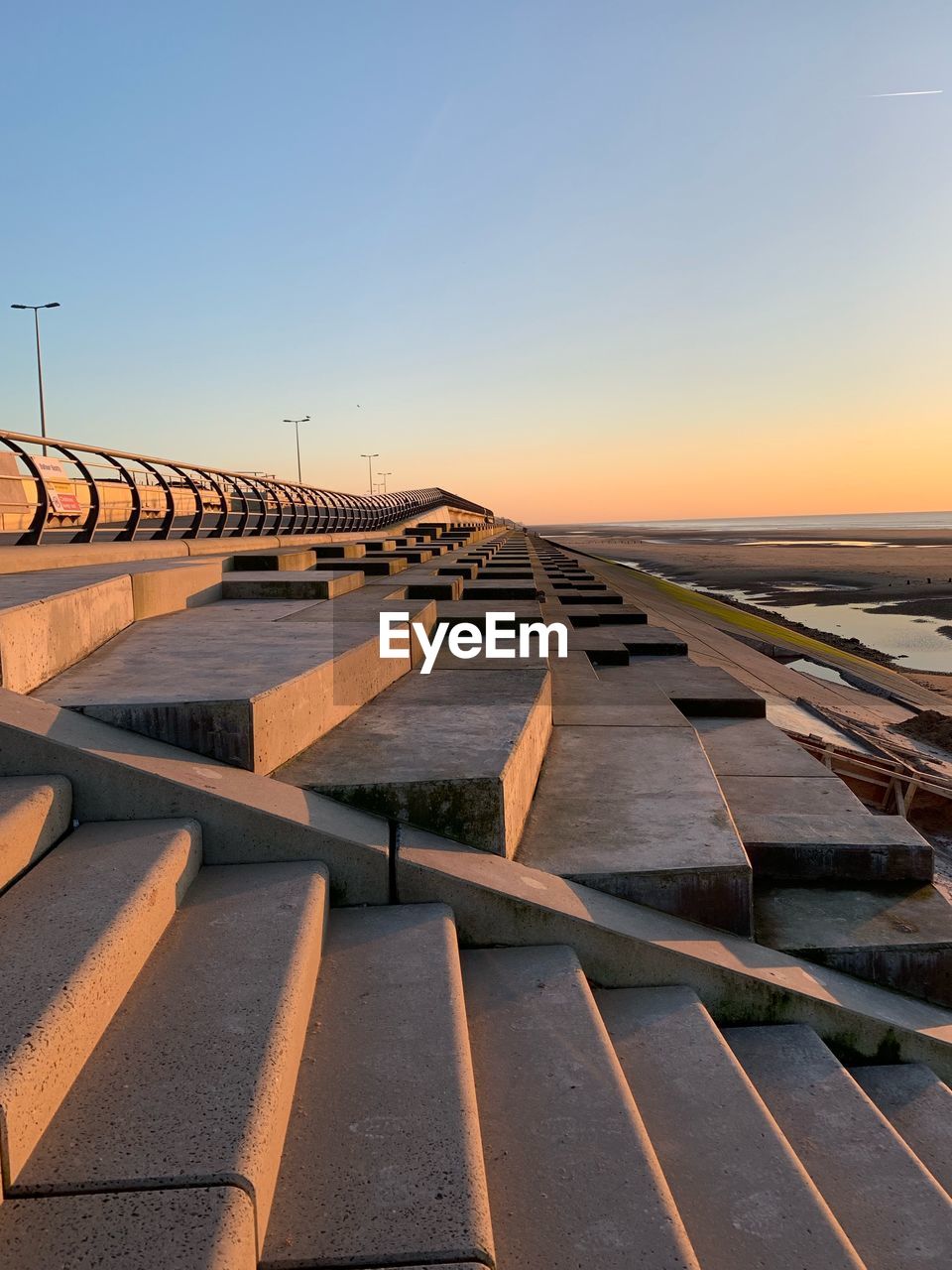 Scenic view of sea against clear sky during sunset