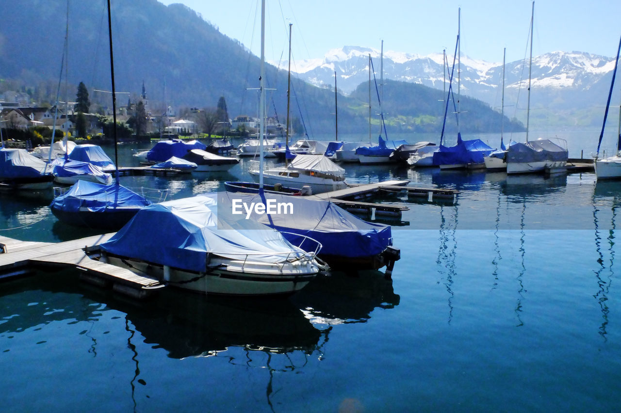 Boats moored on lake