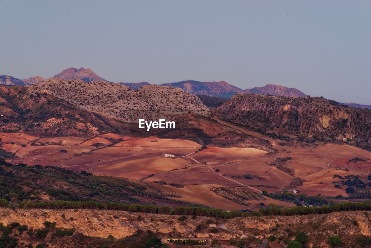 Scenic view of arid landscape against clear sky