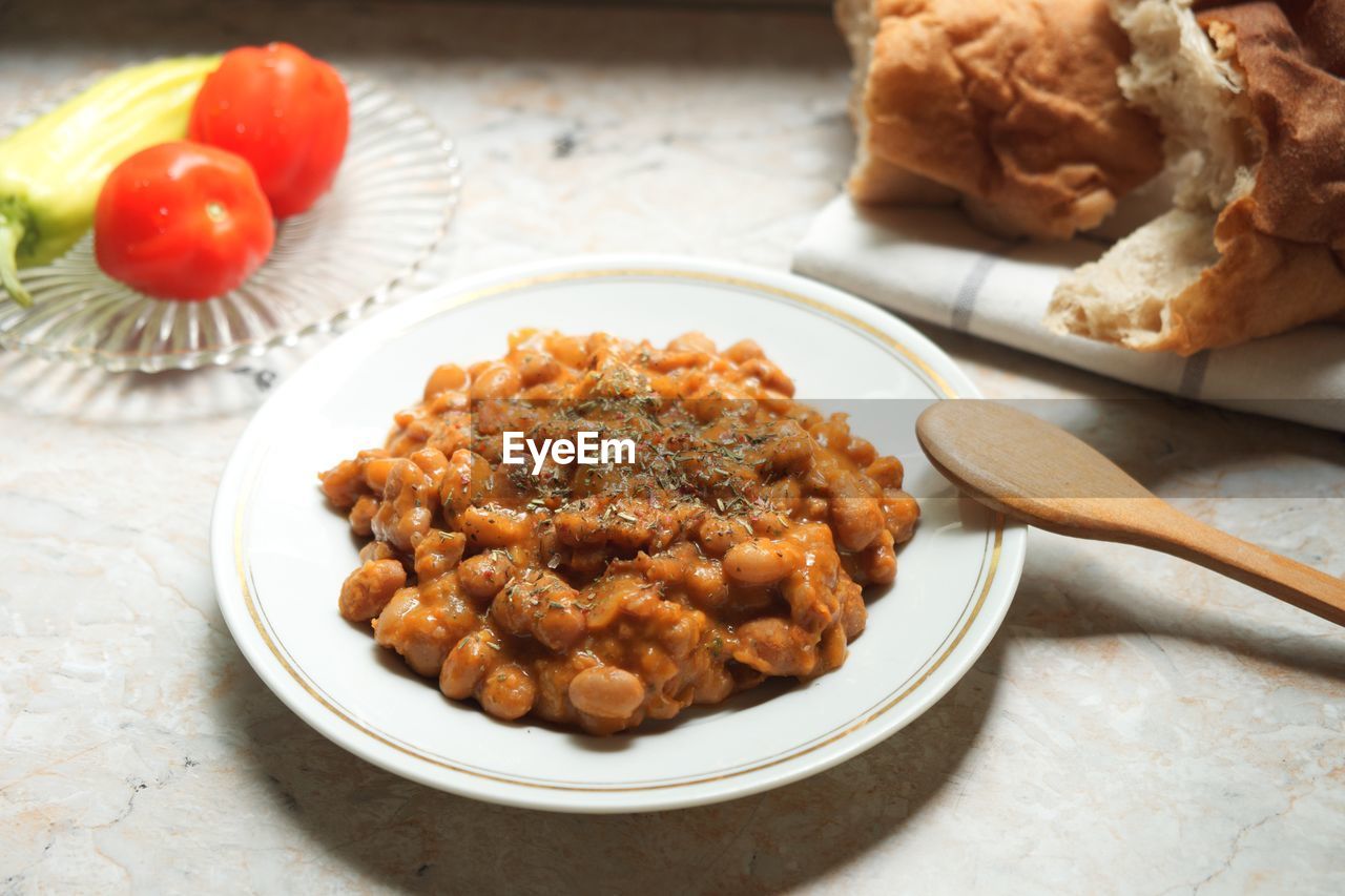 Curry bean, tasty vegan protein meal rustic background 