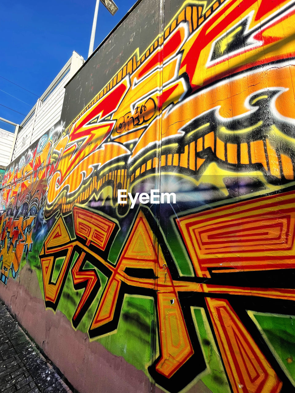 multi colored, architecture, art, graffiti, built structure, building exterior, creativity, mural, no people, city, day, painting, urban area, wall - building feature, pattern, building, outdoors, sky, street art, low angle view