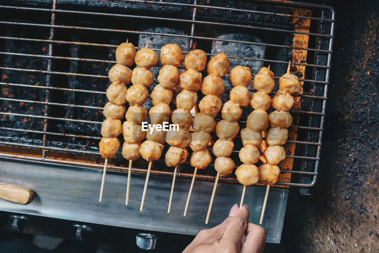 HIGH ANGLE VIEW OF MEAT ON BARBECUE