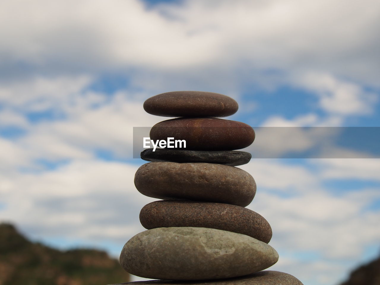 STACK OF PEBBLES IN A ROW OF A CLOUDS