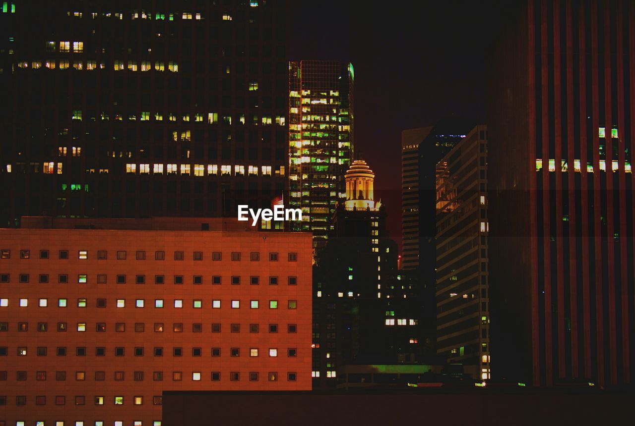 View of buildings lit up at night