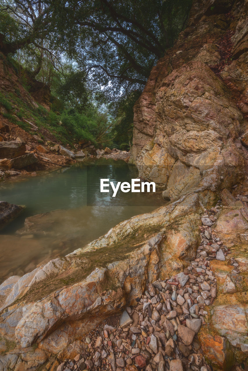 RIVER AMIDST ROCKS