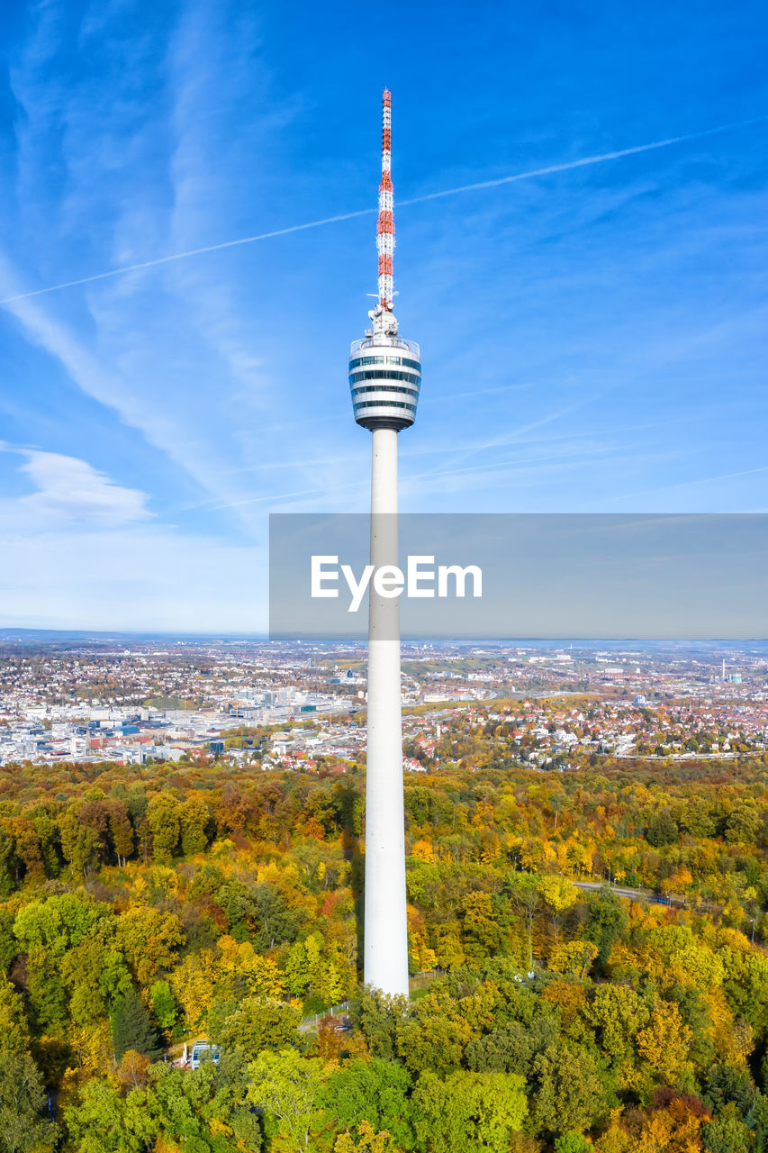 TOWER AMIDST BUILDINGS AGAINST SKY