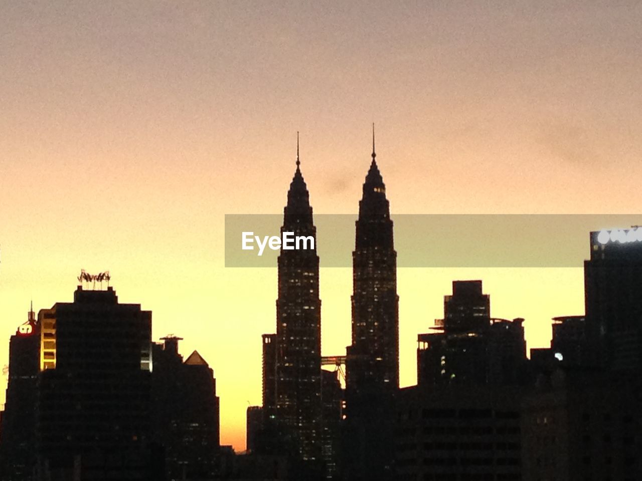 SILHOUETTE OF BUILDINGS AT SUNSET