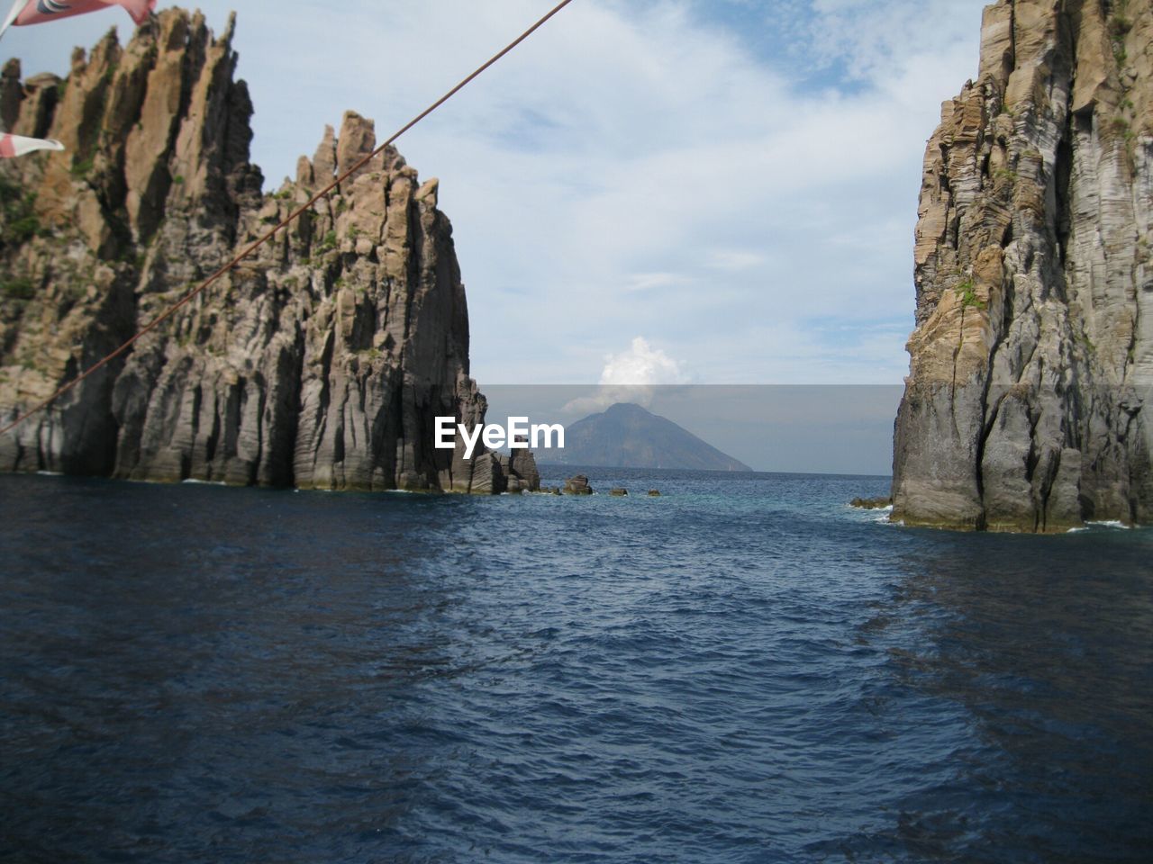 Panoramic view of sea and mountains against sky