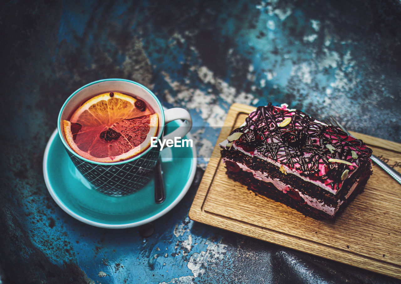 High angle view of tea and cake on table