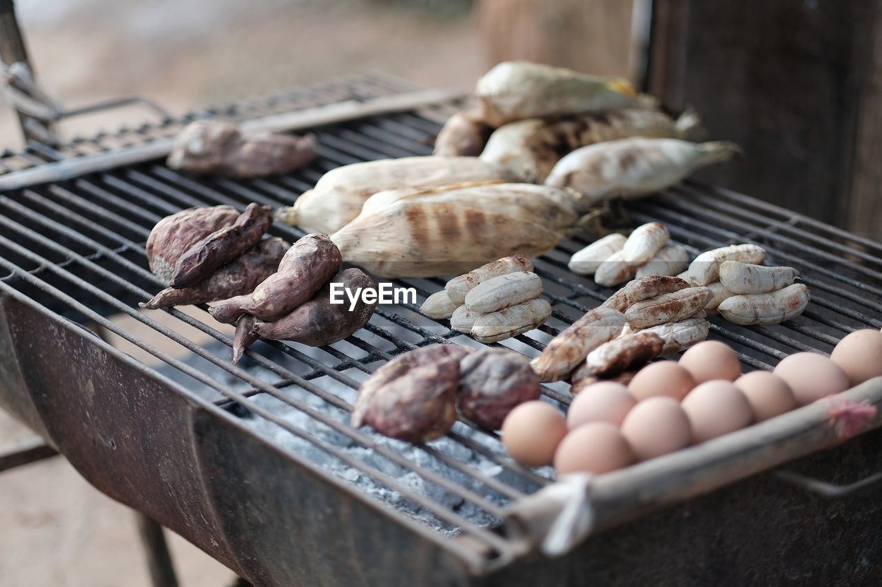 High angle view of meat on barbecue grill