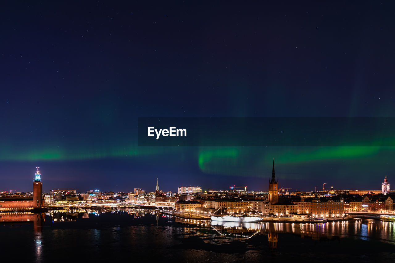 View of stockholm city with northern lights above
