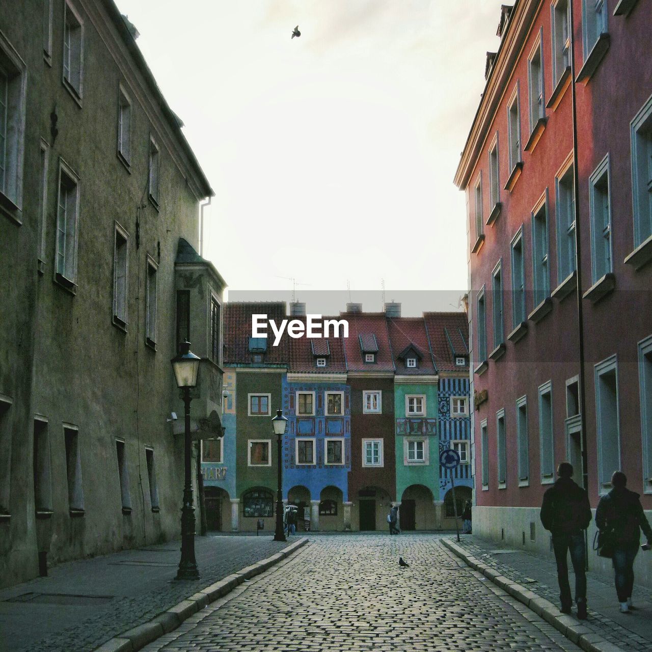 Street leading towards colorful residential buildings