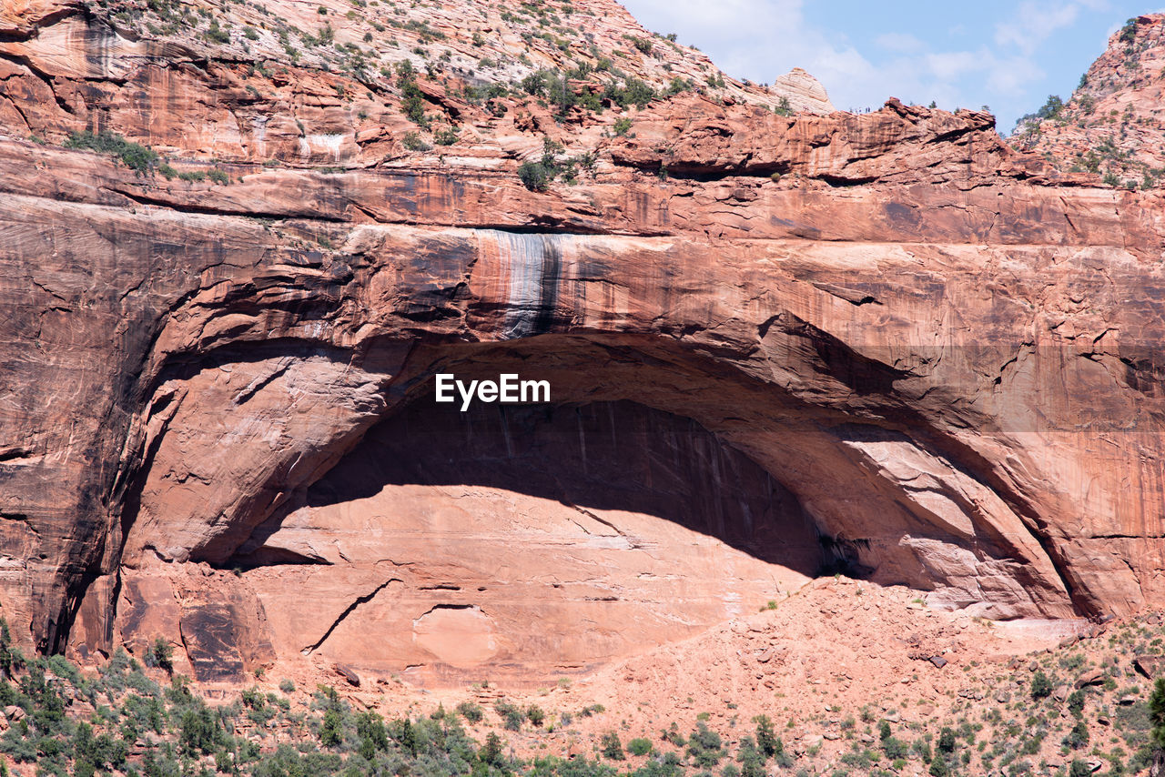 LOW ANGLE VIEW OF ROCKS ON ROCK FORMATION