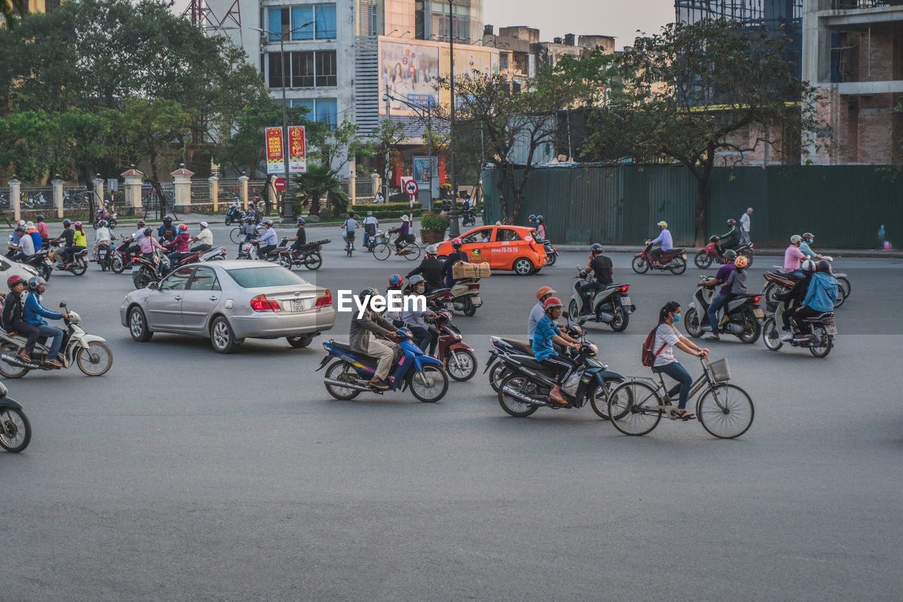 PEOPLE RIDING BICYCLES ON STREET